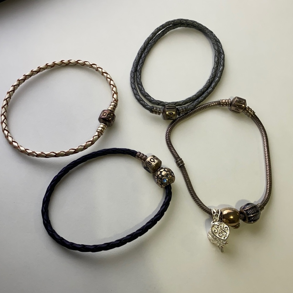 FOUR PANDORA BRACELETS W FOUR CHARMS